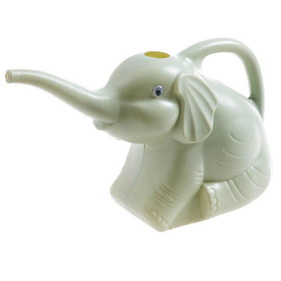 Baby elephant watering flowers